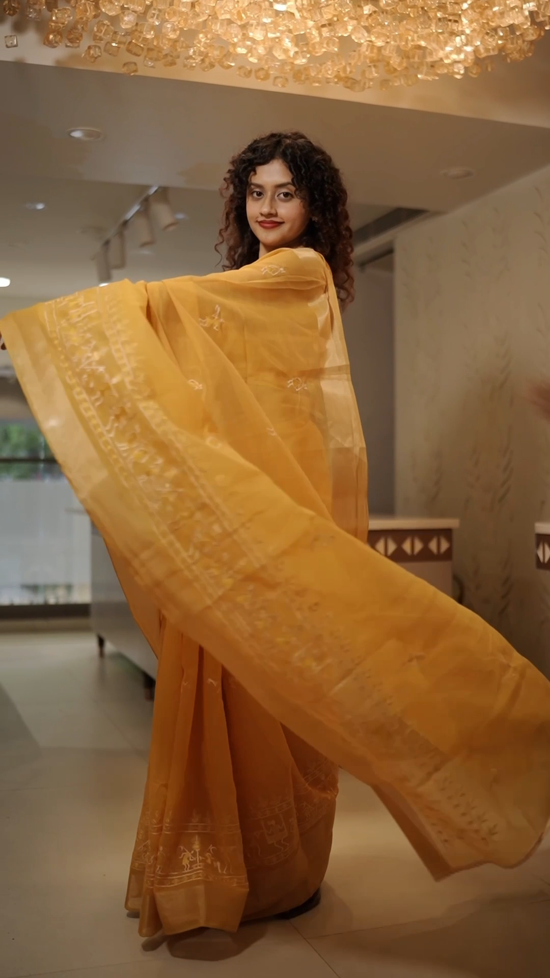 Full-length view of Yellow Varli Art Vegan Silk Saree – 5.60 metres with tribal thread work | Navrang Drapes